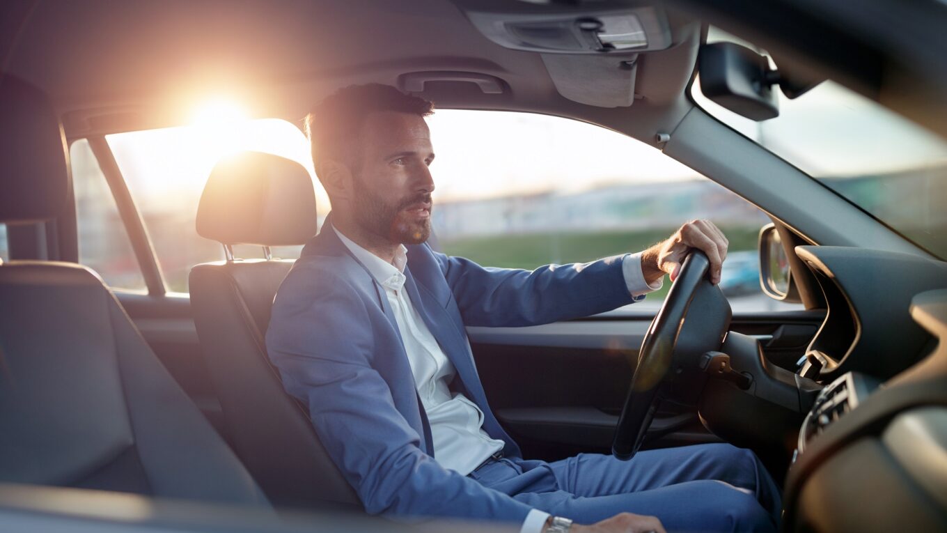 Businessman manager traveling in car